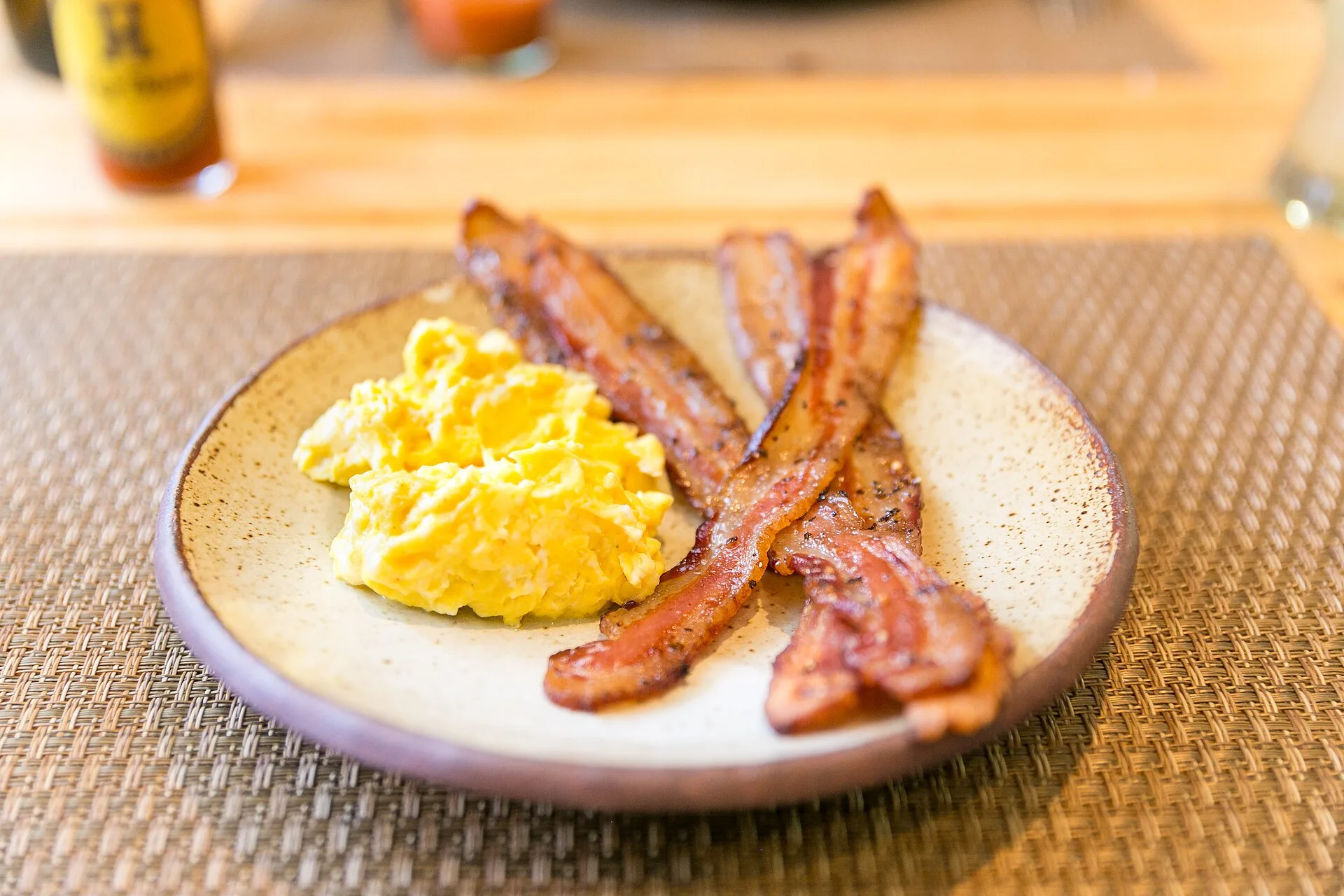 Two farm eggs with black pepper bacon, photographed by City Foodsters on a 2014 visit to Charleston.