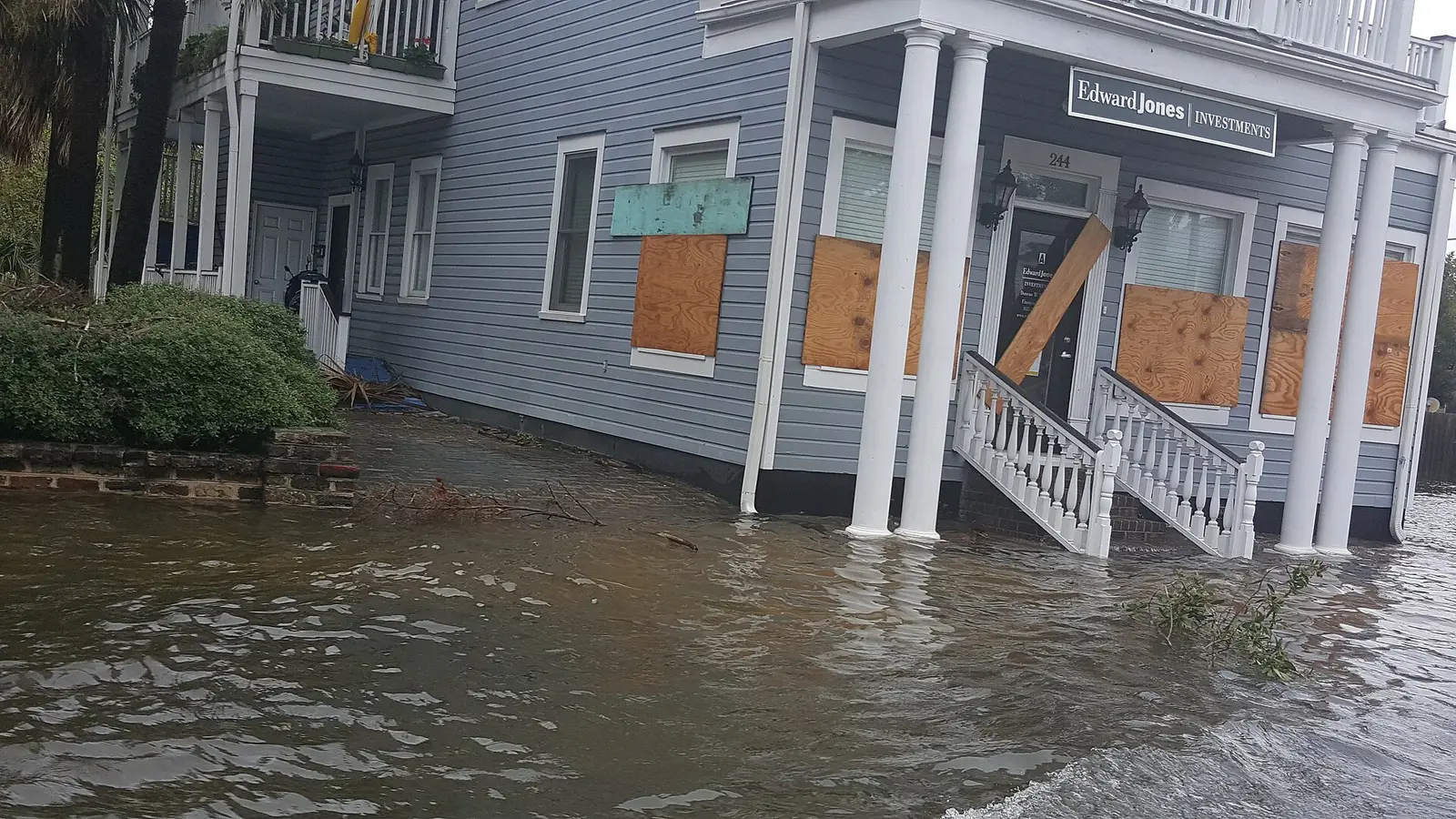 Floodwater surrounds a boarded-up office building in Charleston after Hurricane Matthew.