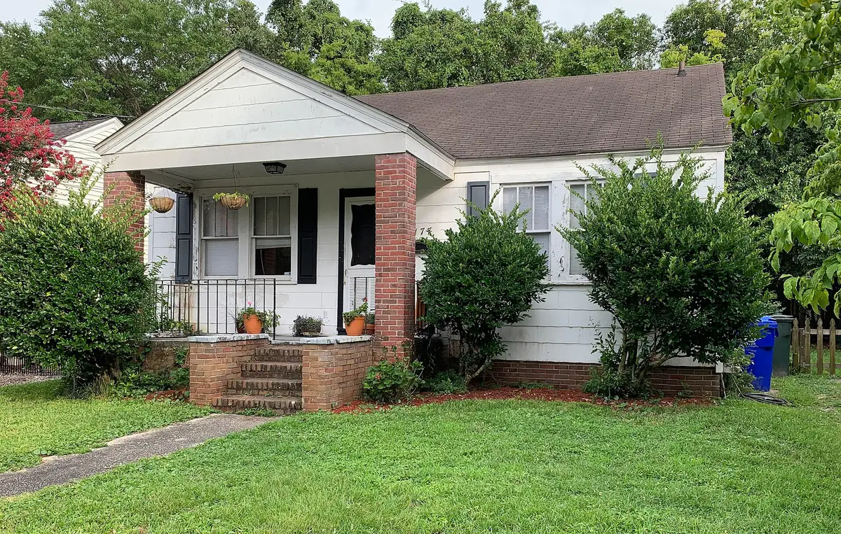 A one-story house on Gordon Street in the Wagener Terrace neighborhood, with its roll cart at the side.