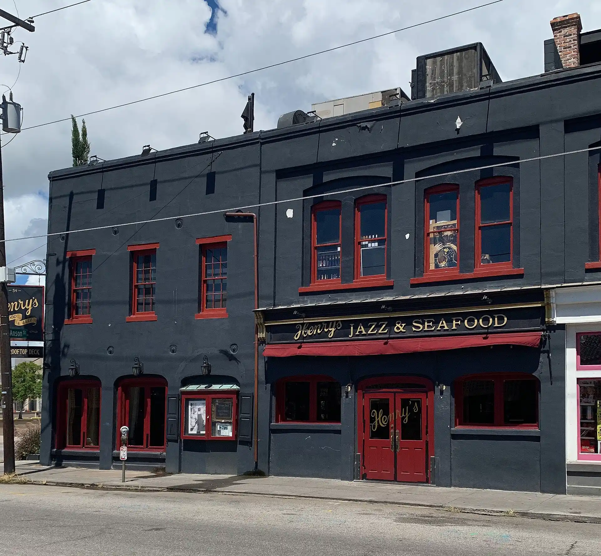 Henry's on the Market at 54 N. Market St. in downtown Charleston, with the sign for its rooftop deck at left.