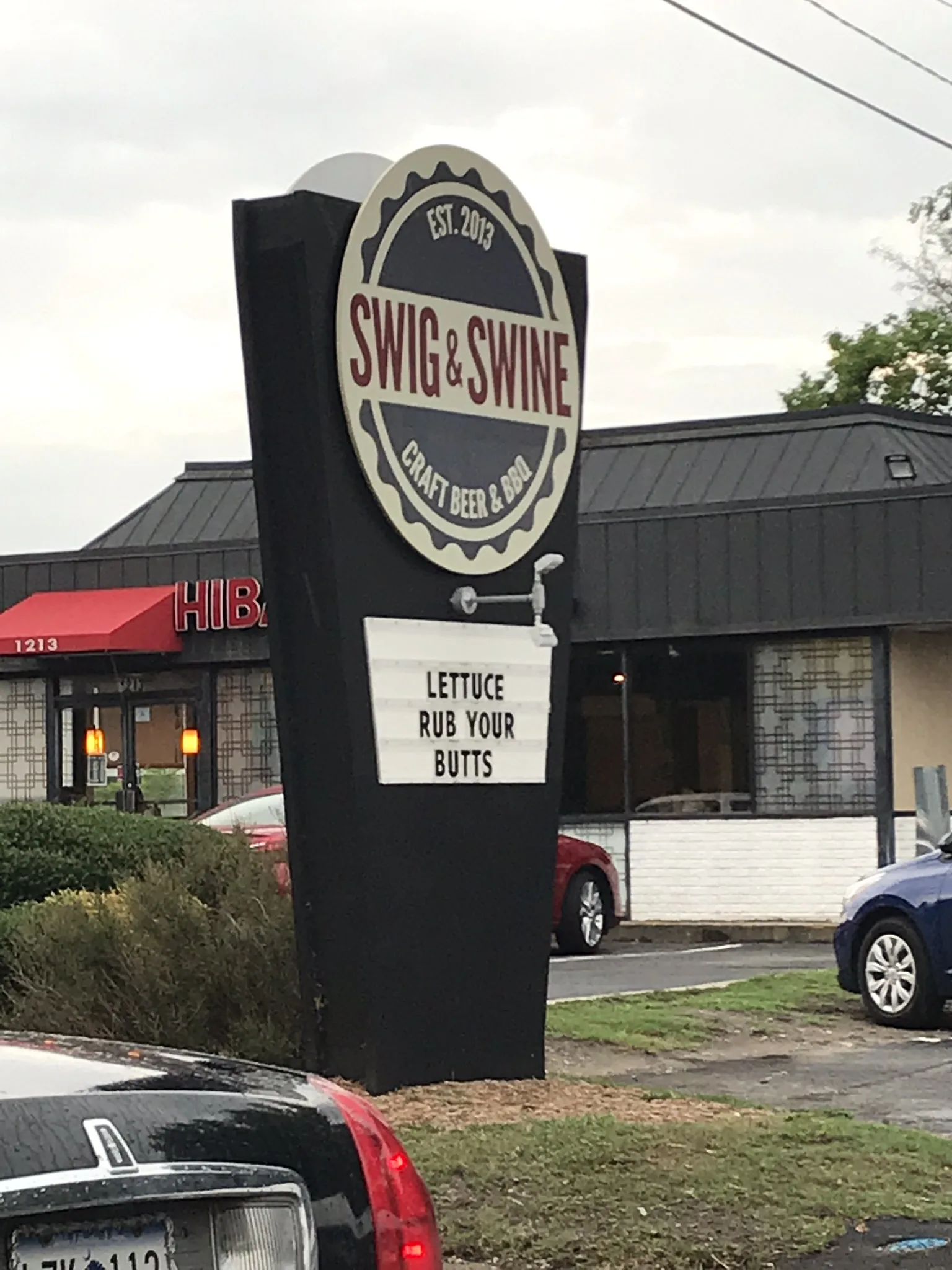 The roadside sign at Swig & Swine on Savannah Highway in West Ashley.
